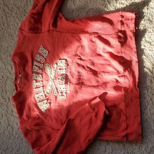 Comfy and warm sweater. The tag has been cut off. It's a medium to large fit.